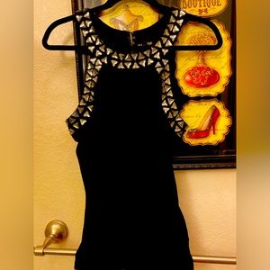 Express black with Smokey jewels around neckline and arms dressy top.